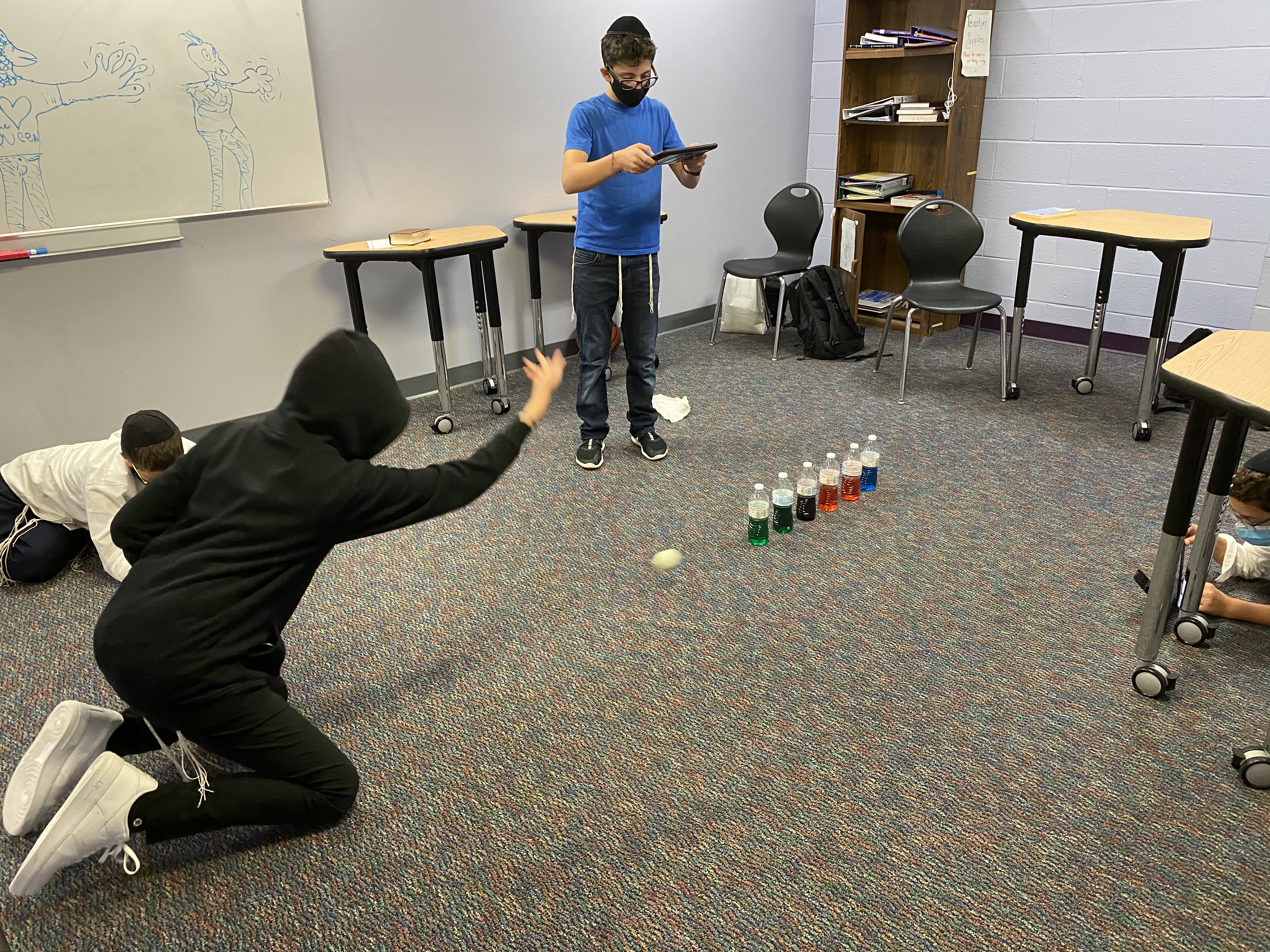 Water bottle bowling to show balanced and unbalanced forces