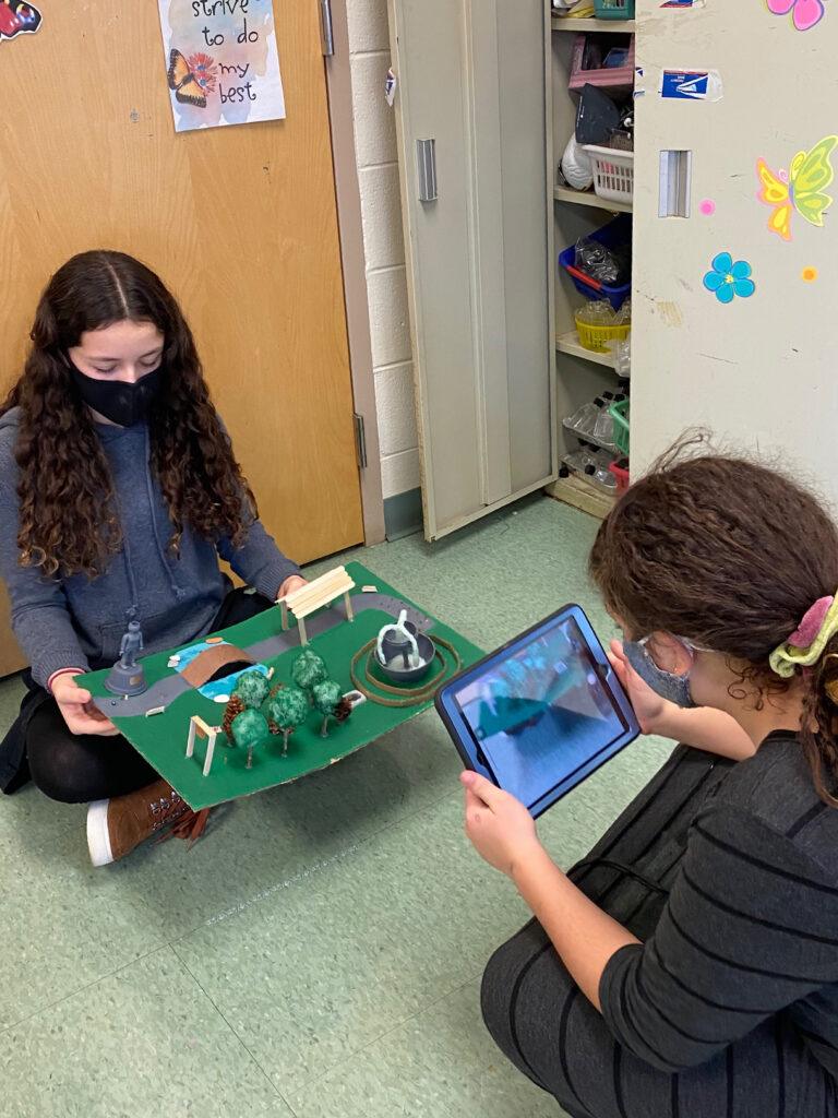 Students take photo of stem magnet maze project